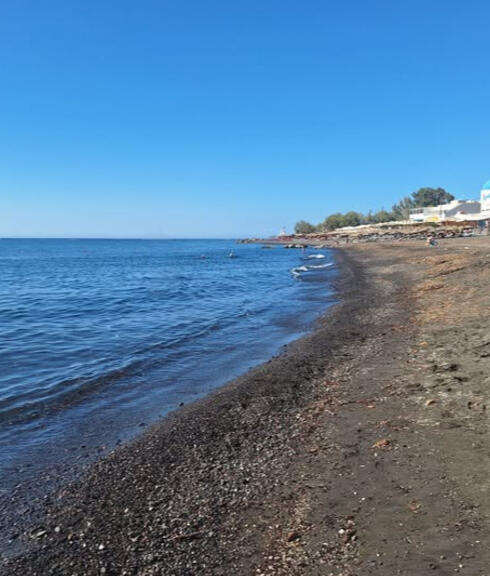 Perissa’s black-sand beach, a short walk from Youth Hostel Anna